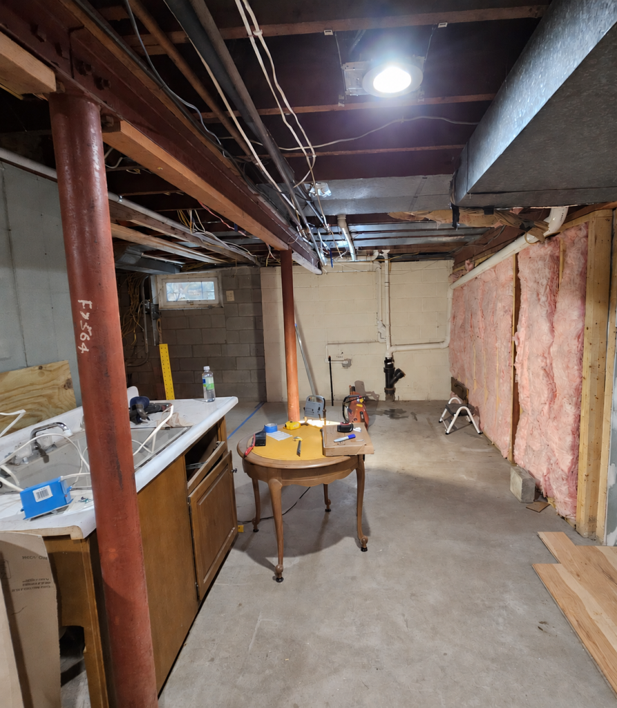 The unfinished corner of the basement where the bathroom would go.